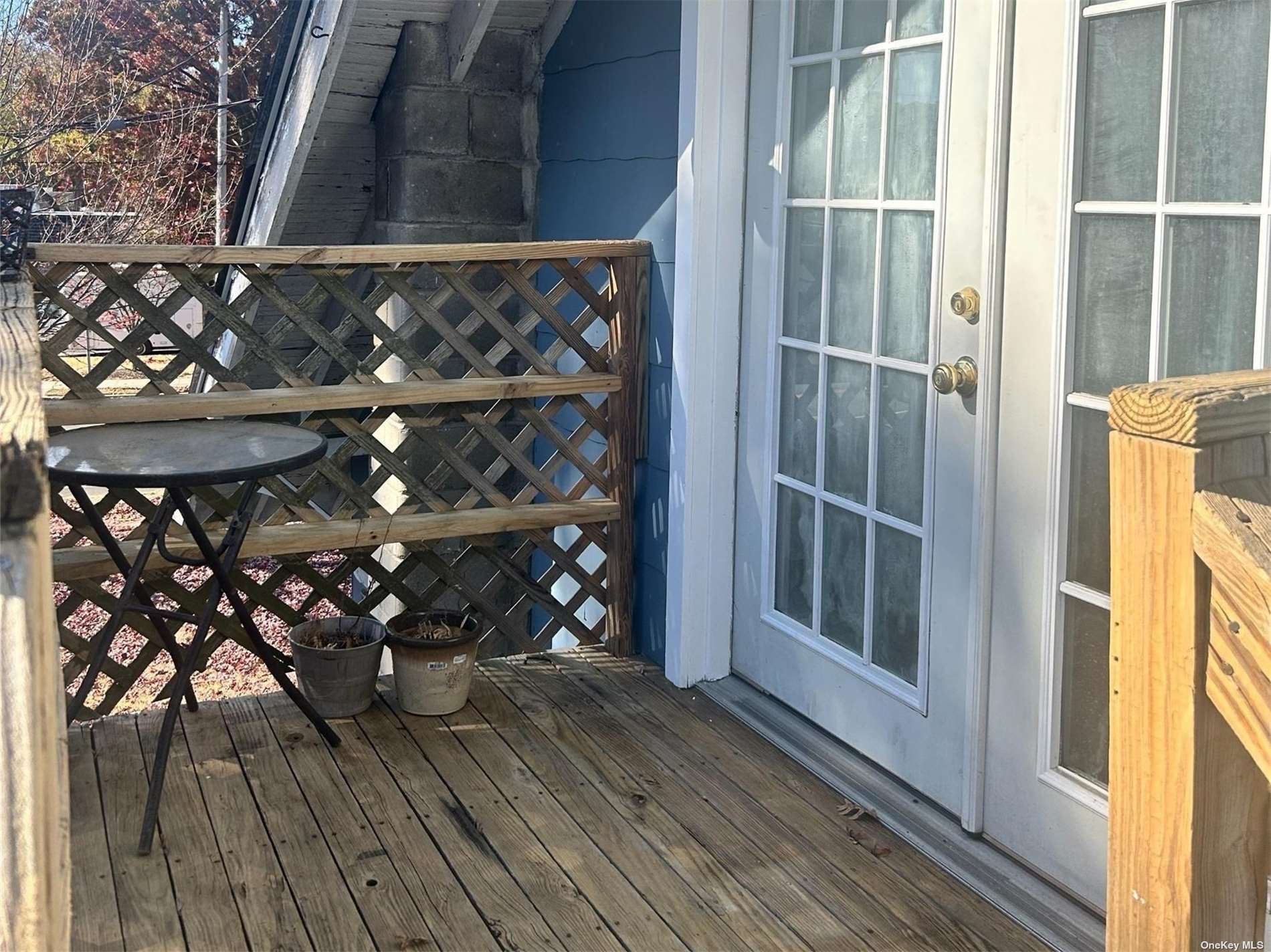 a view of outdoor space with wooden floor