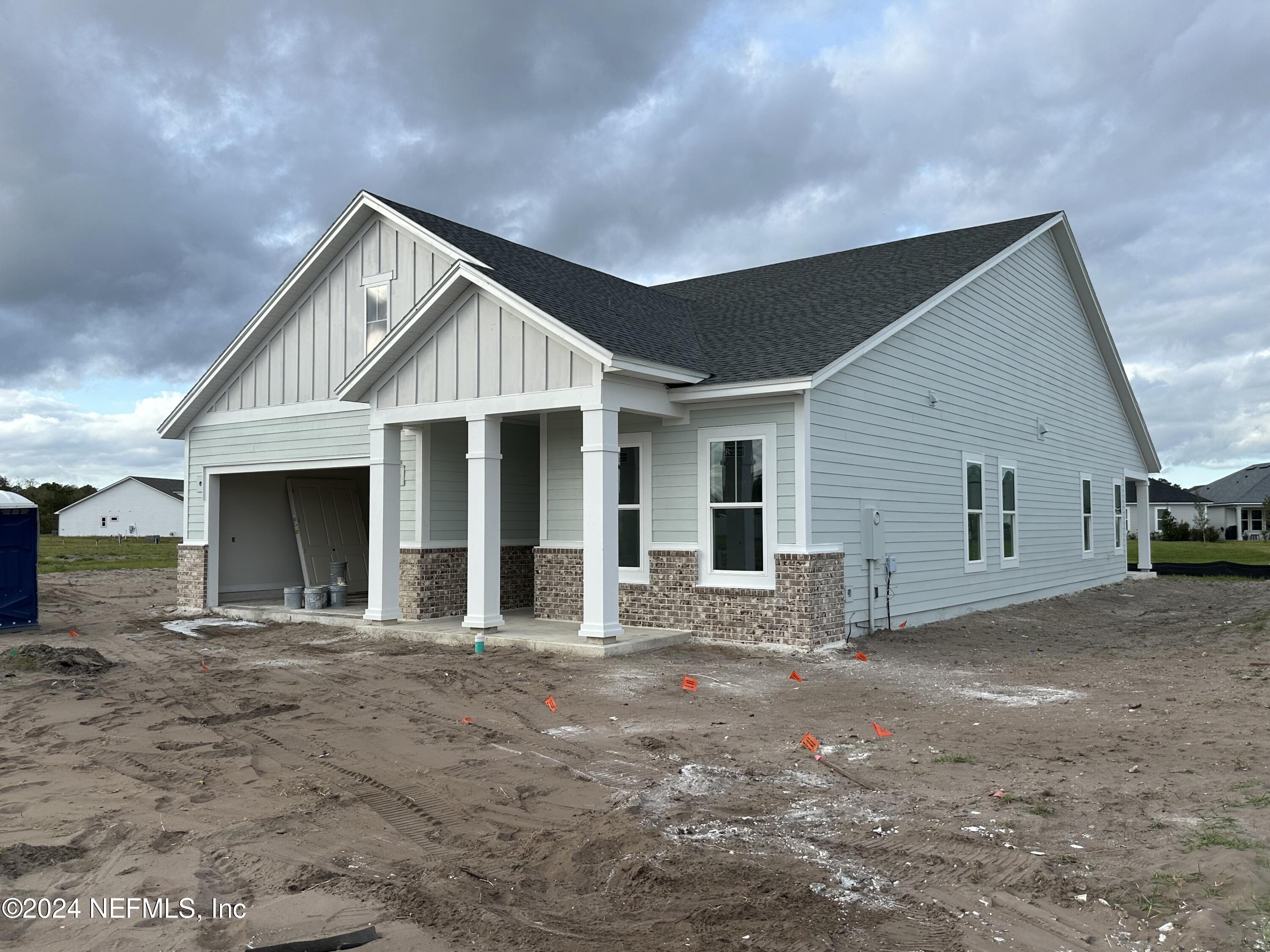 a front view of a house with yard