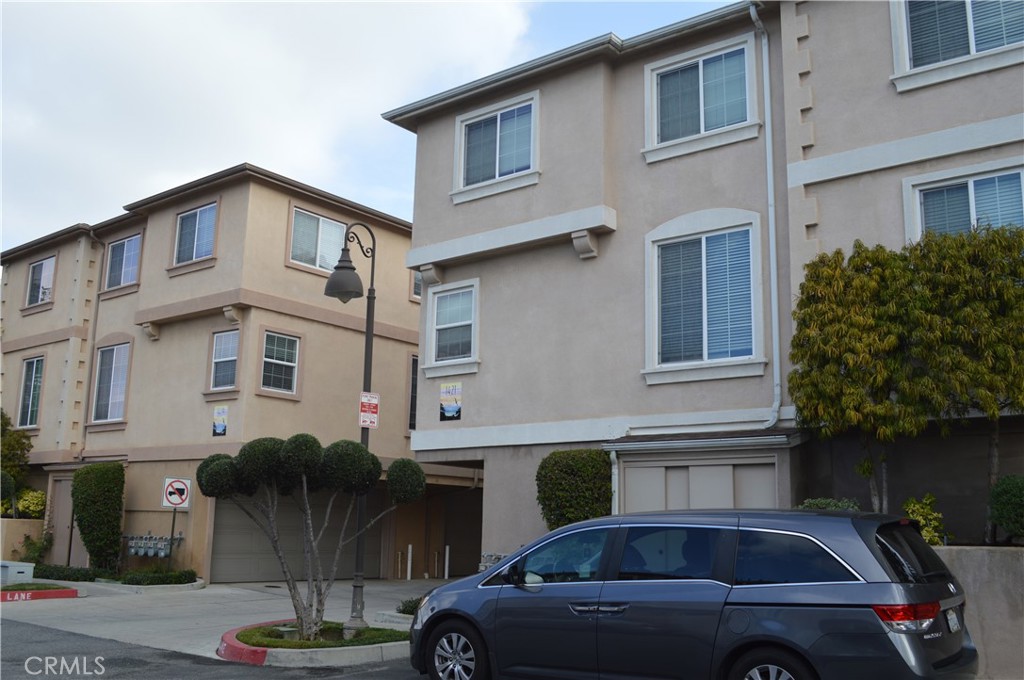 a front view of a house with parking