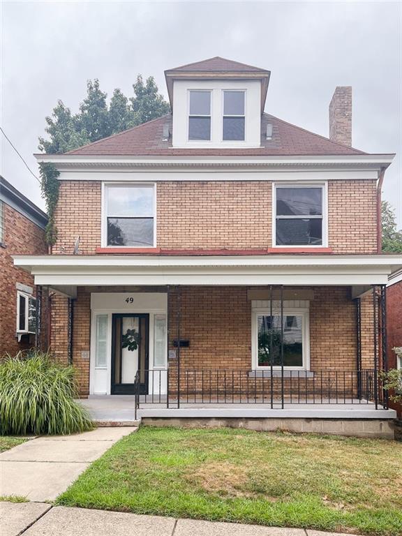 front view of a house with a yard