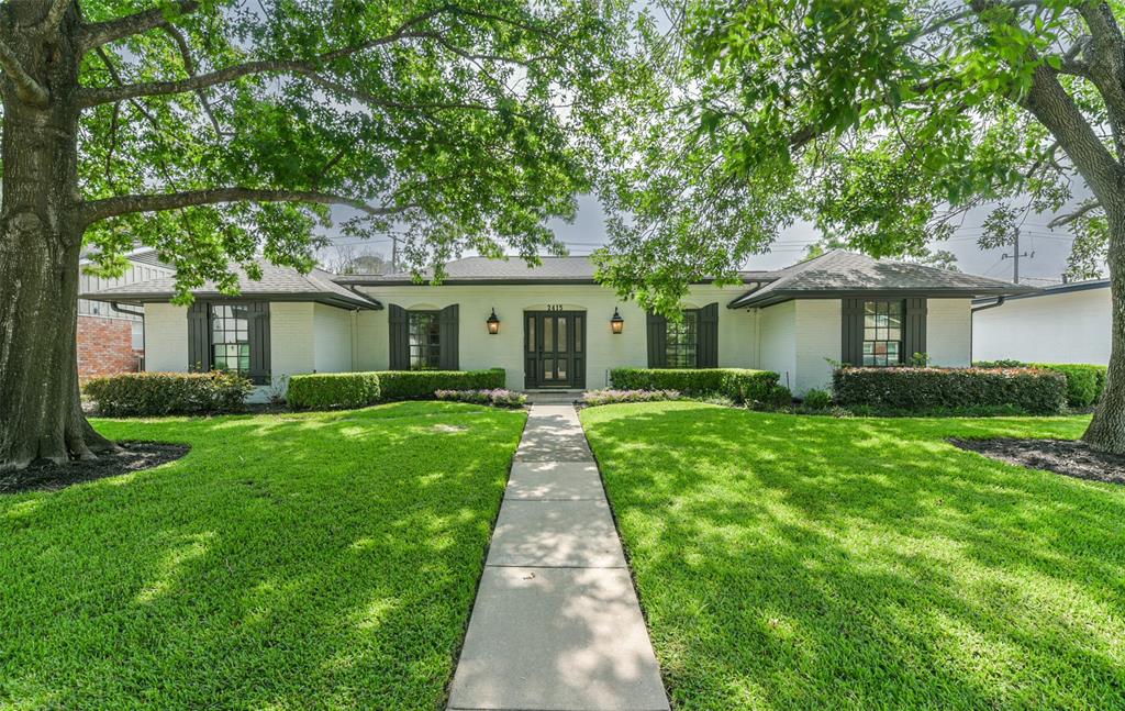 a front view of a house with yard