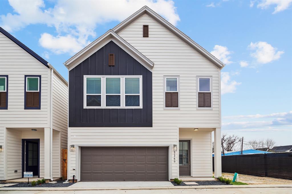 a front view of a house with a garage