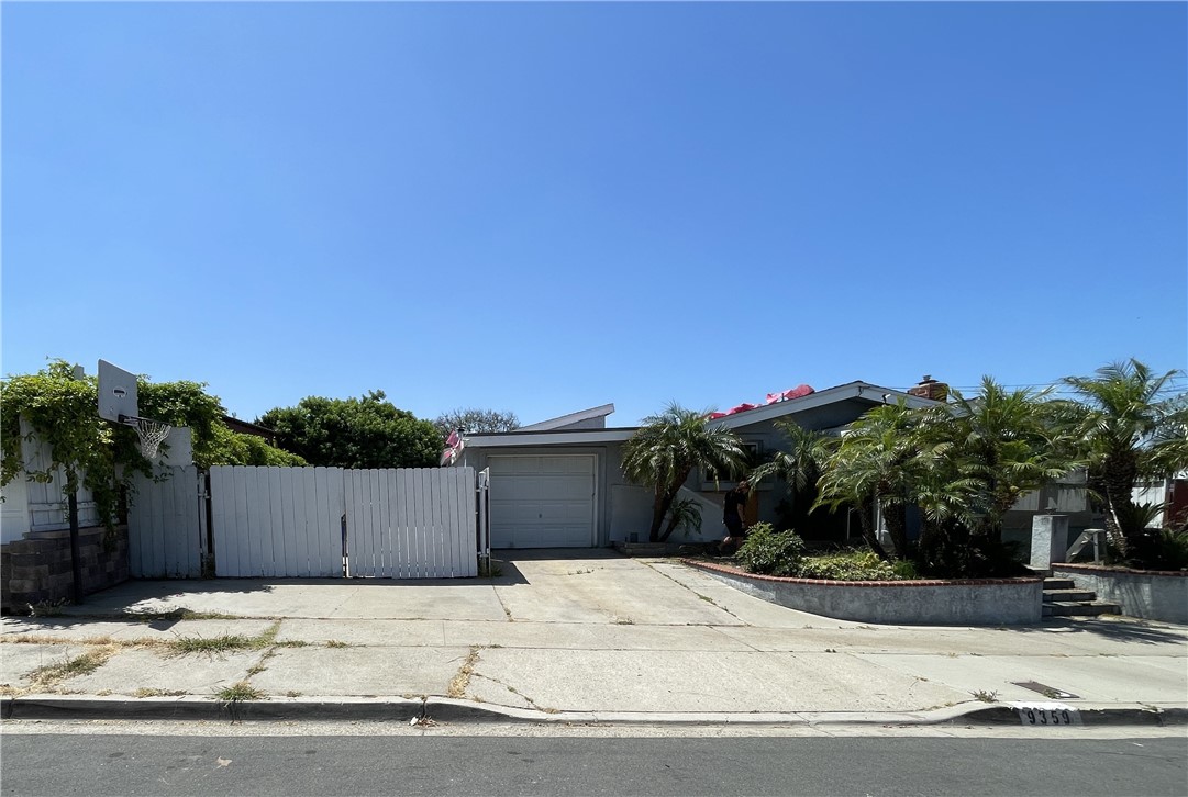 a view of a house with a yard and street view