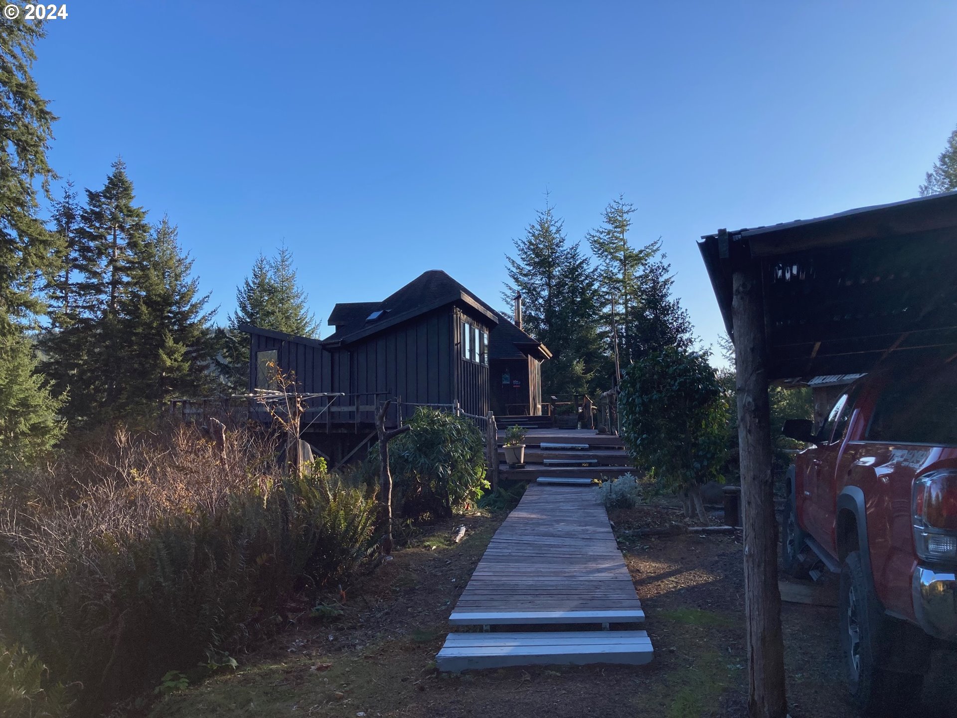 a view of house with yard and green space