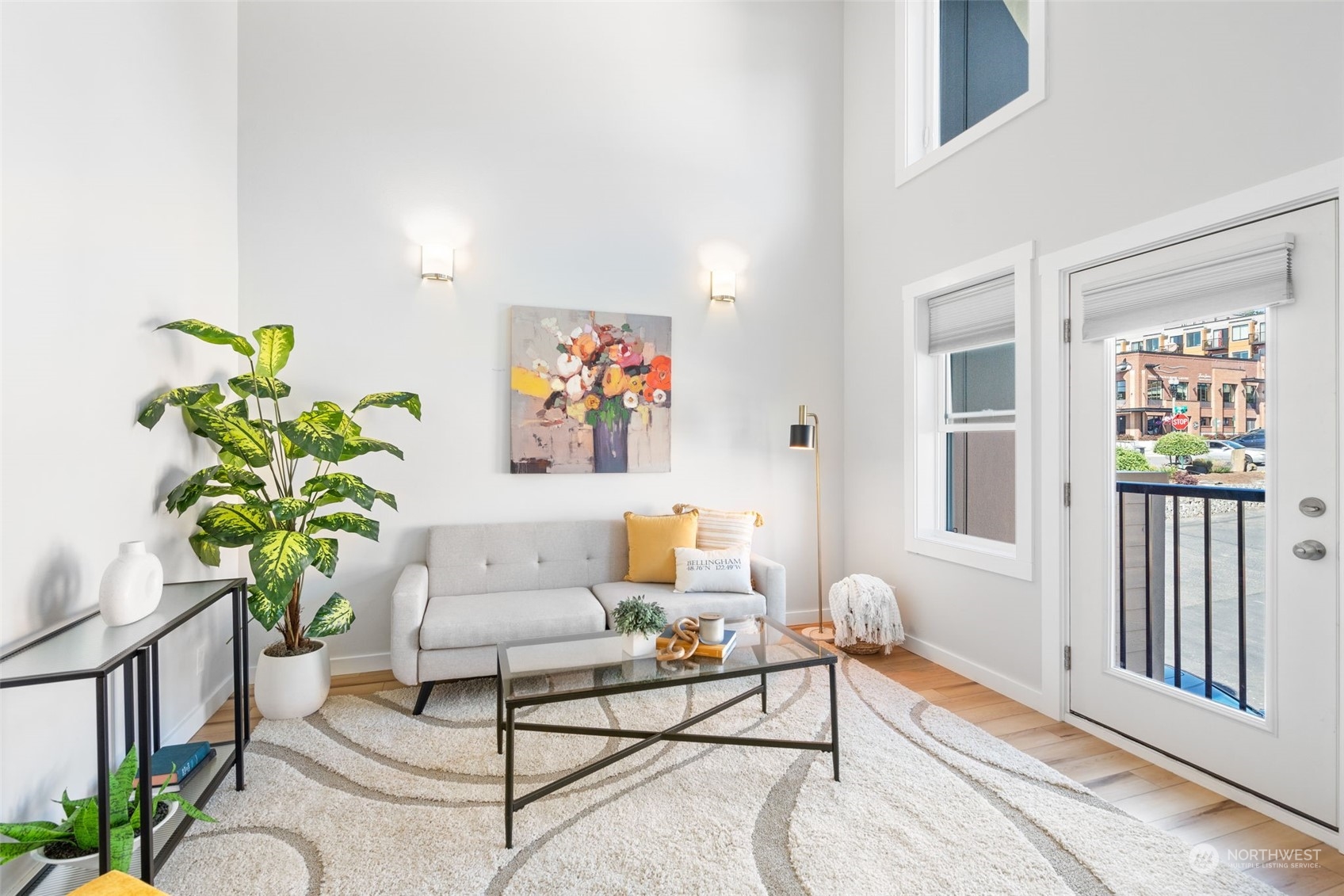 a living room with furniture and flowers