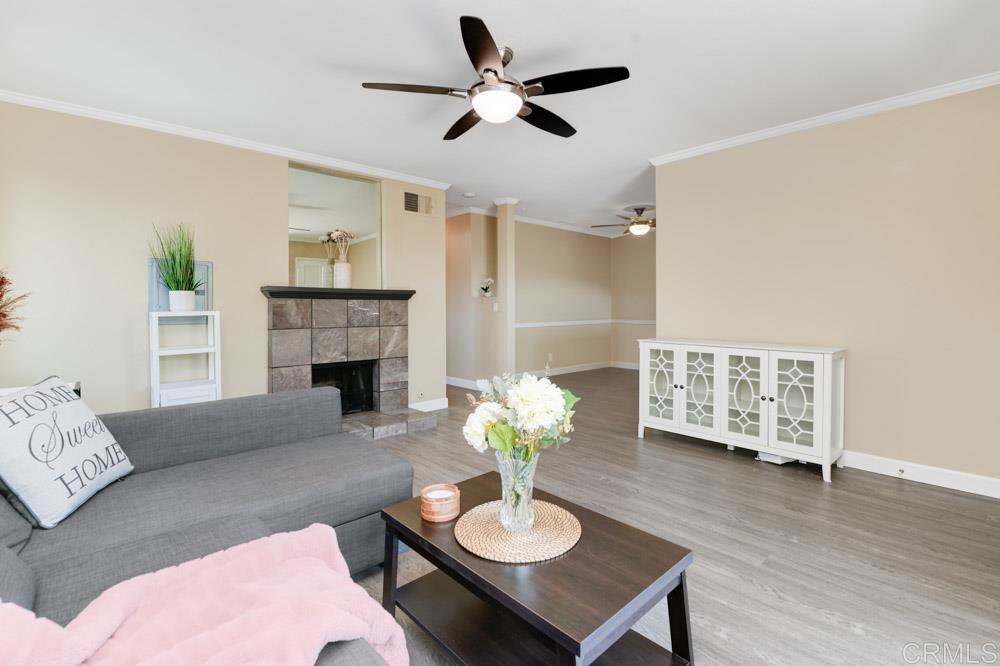 a living room with furniture potted plant and a fireplace