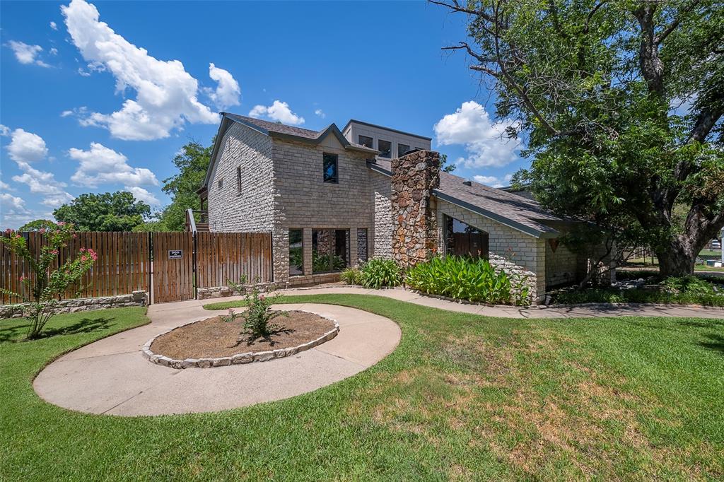 a view of a house with a yard and garage