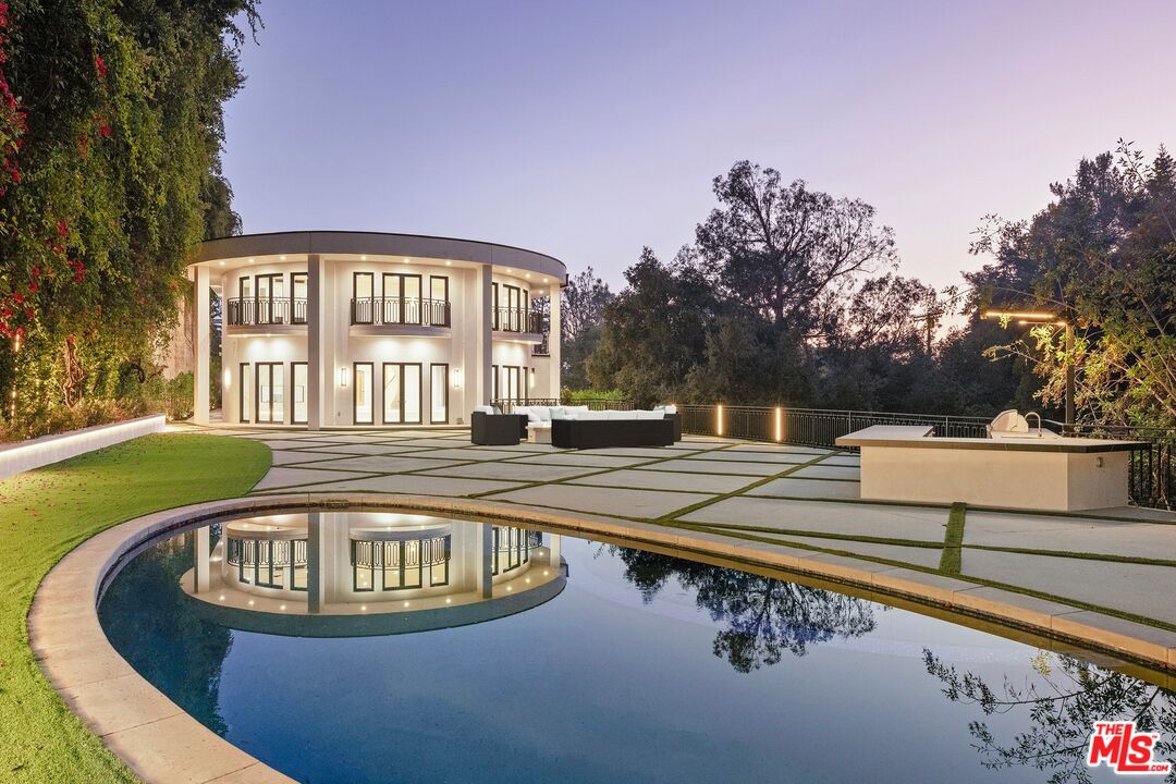 a view of swimming pool with outdoor seating