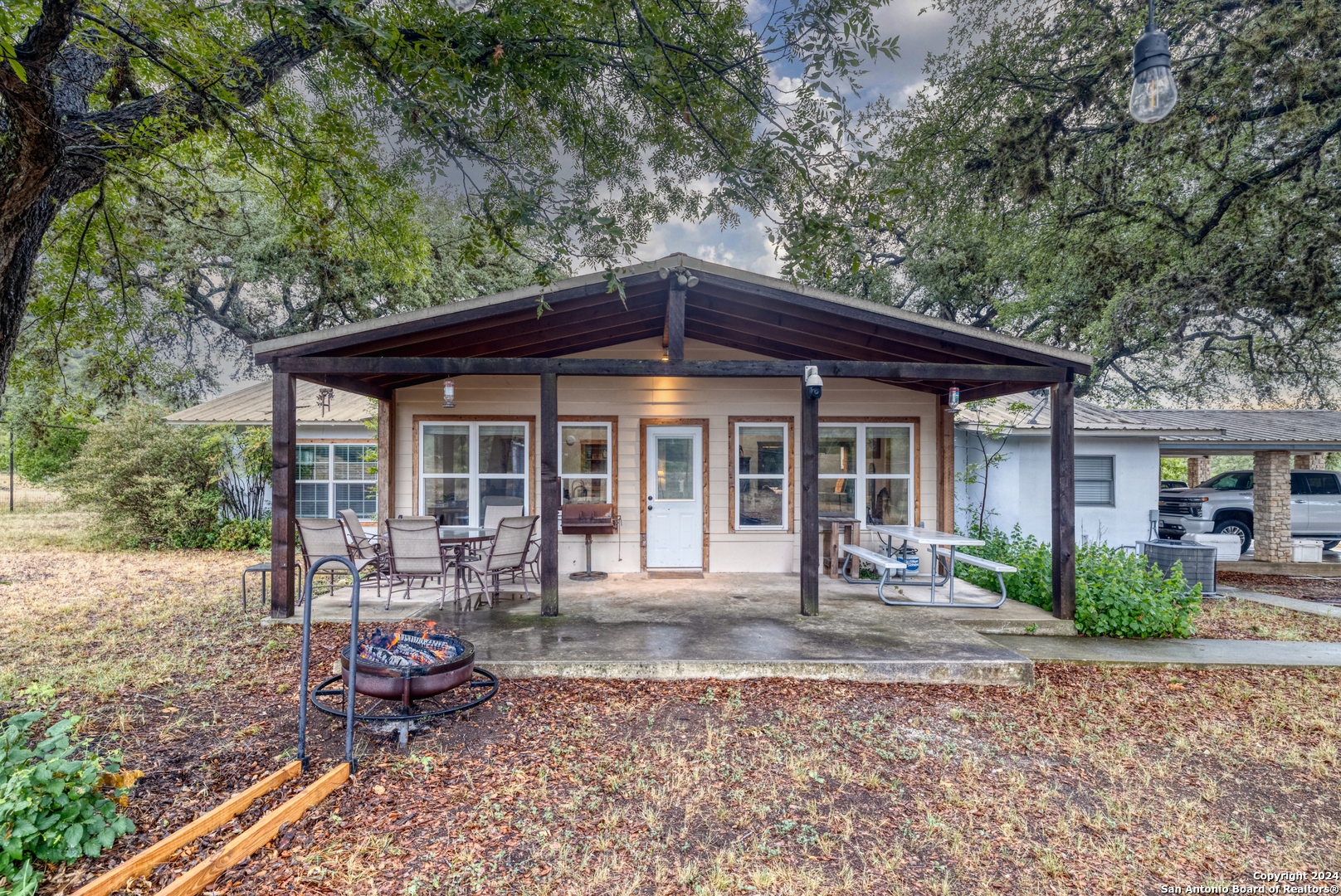 a front view of a house with garden and porch