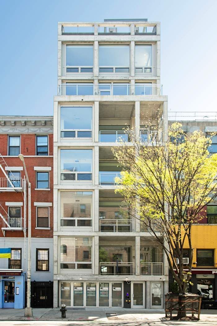 a view of a building with a tree