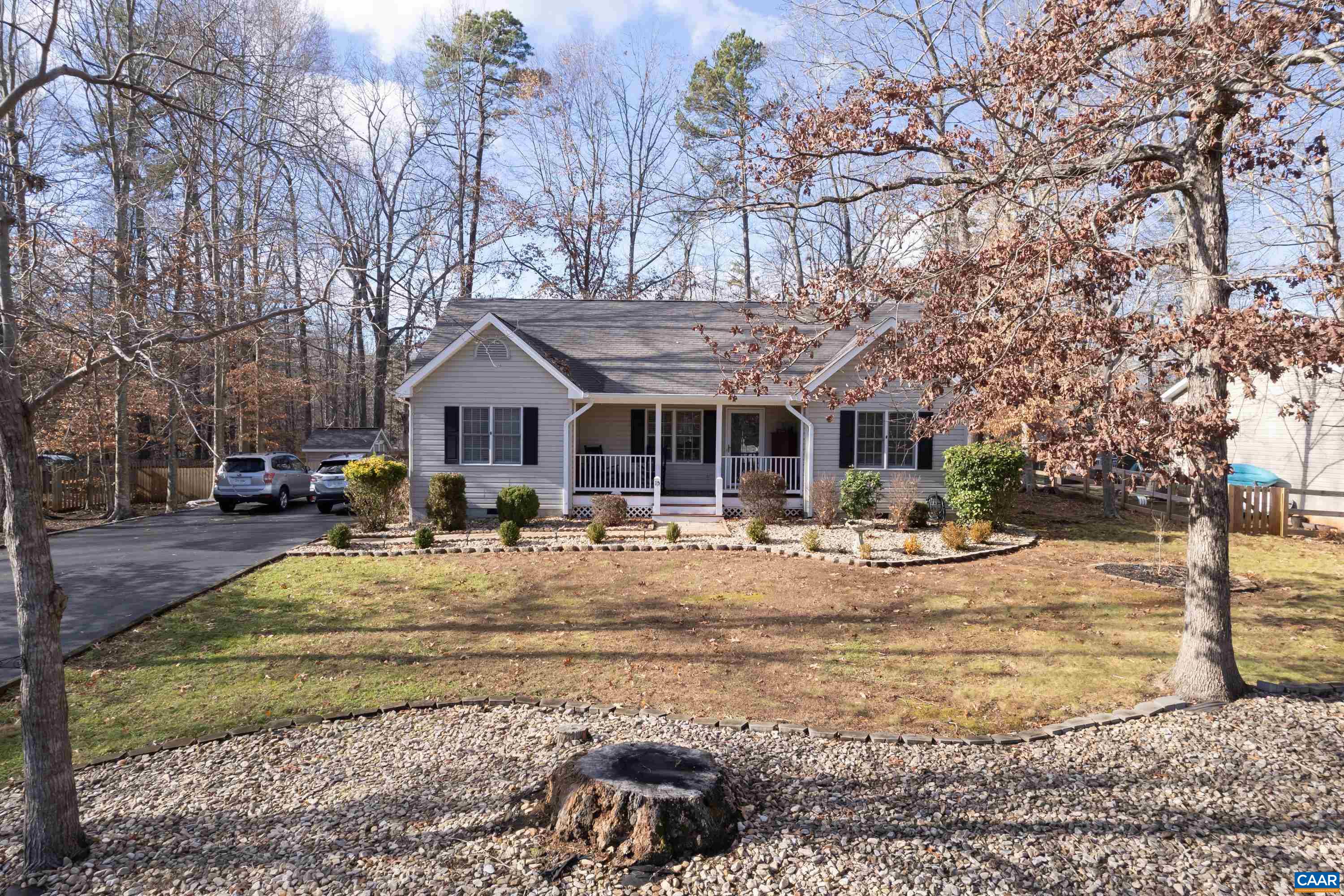 a front view of house with yard patio and dining space