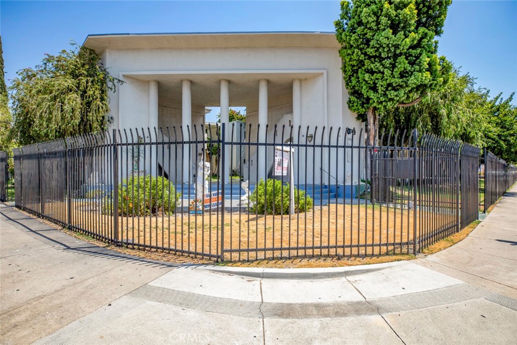 a view of a gate with a fence