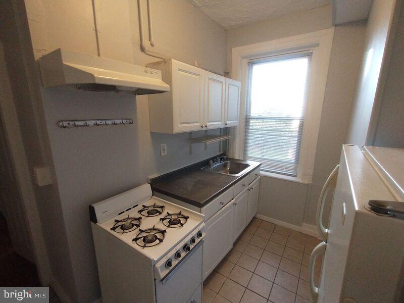 a kitchen with a stove and a microwave