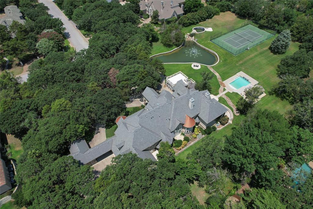 an aerial view of a house with outdoor space and street view