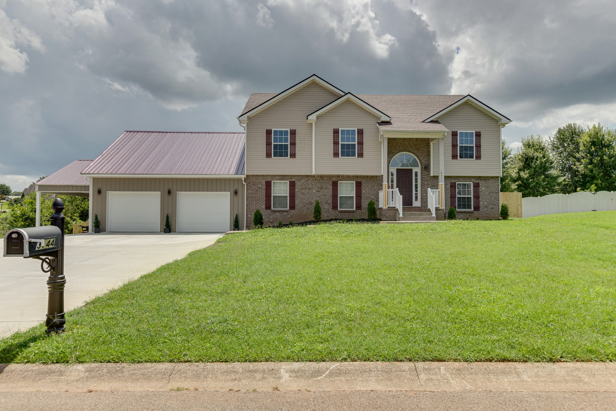 a front view of a house with a yard