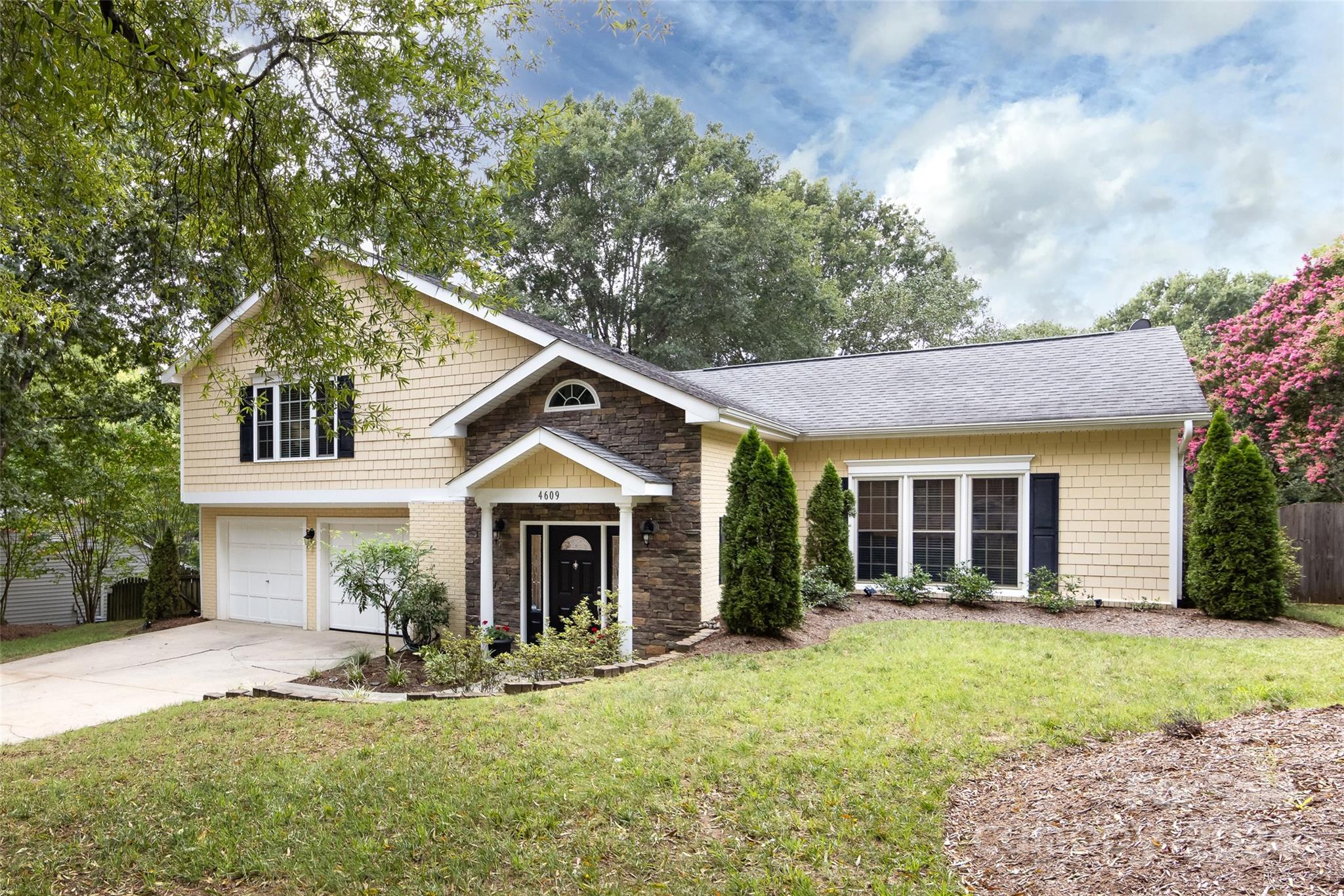 front view of a house with a yard