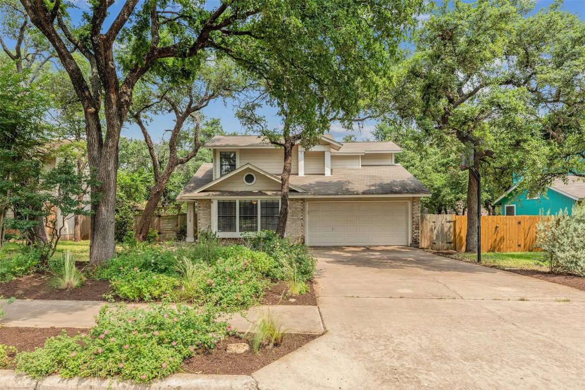 front view of a house with a garden