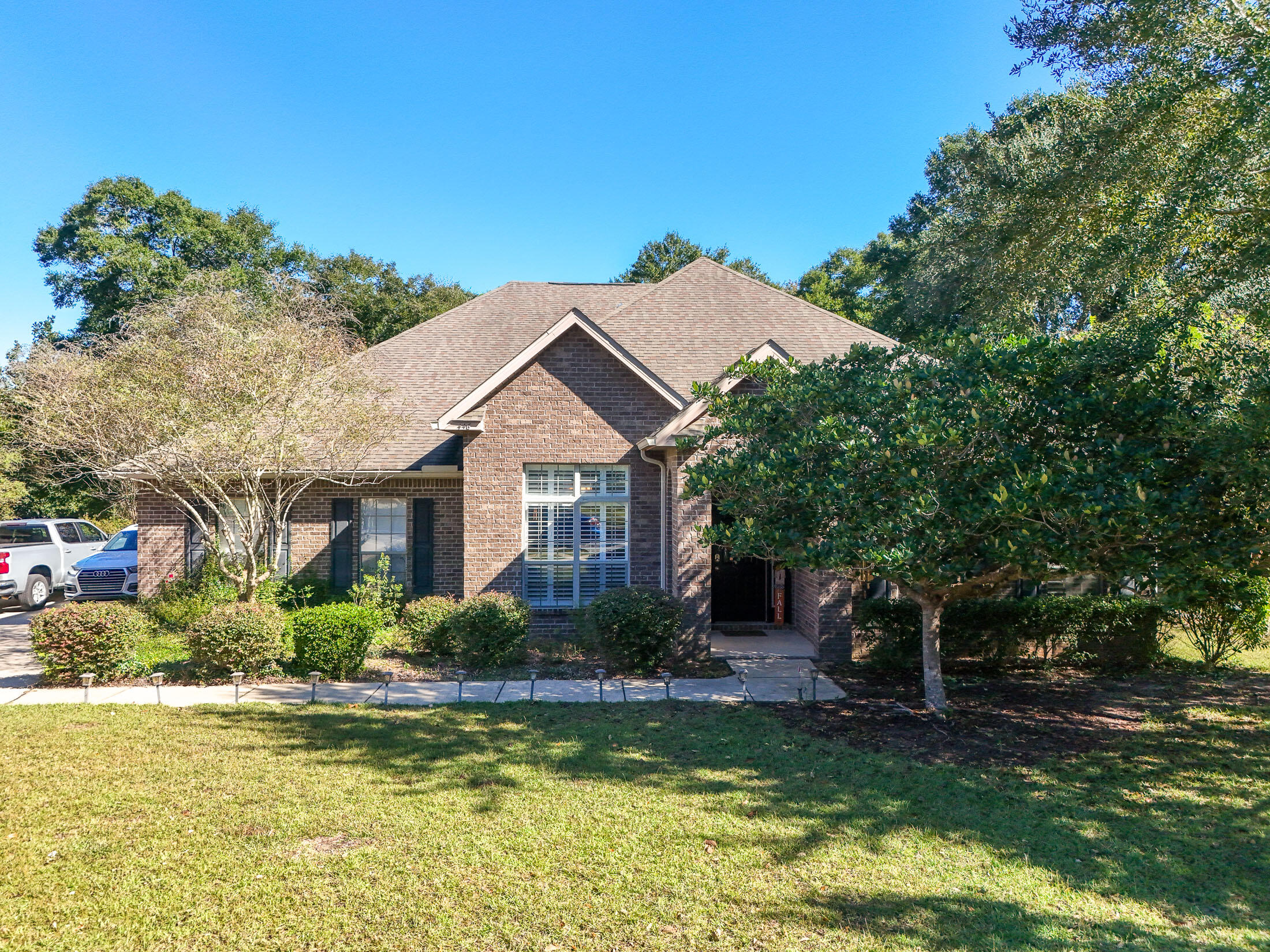 a front view of a house with a yard