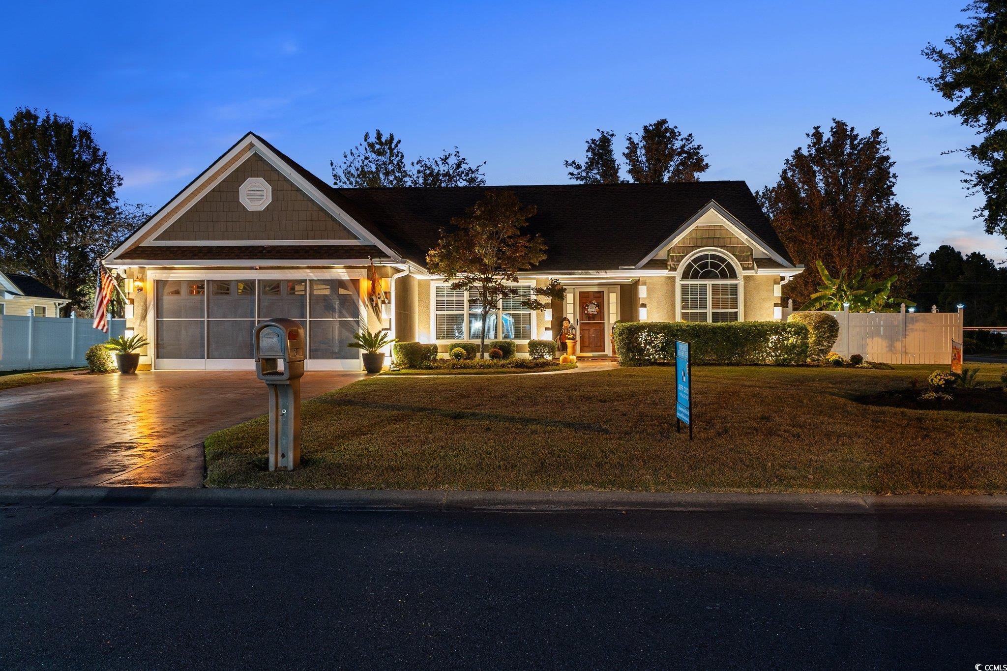 View of front of home featuring a garage