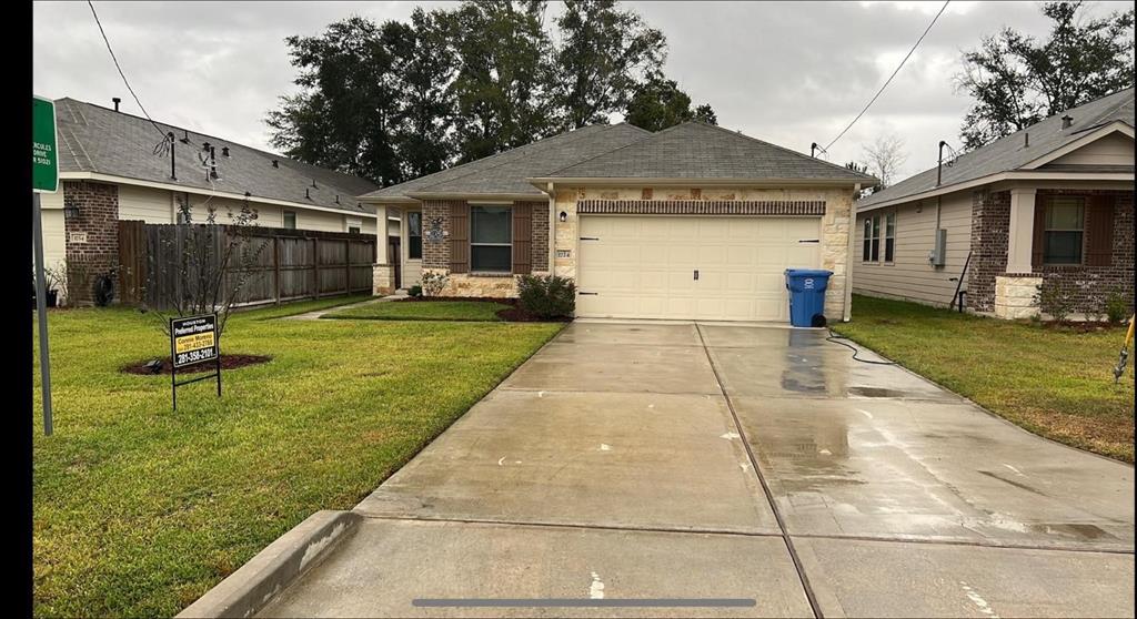 a front view of house with yard and outdoor seating