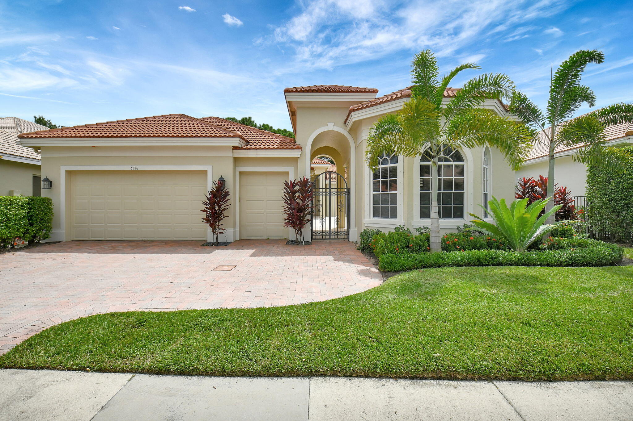 front view of a house with a garden