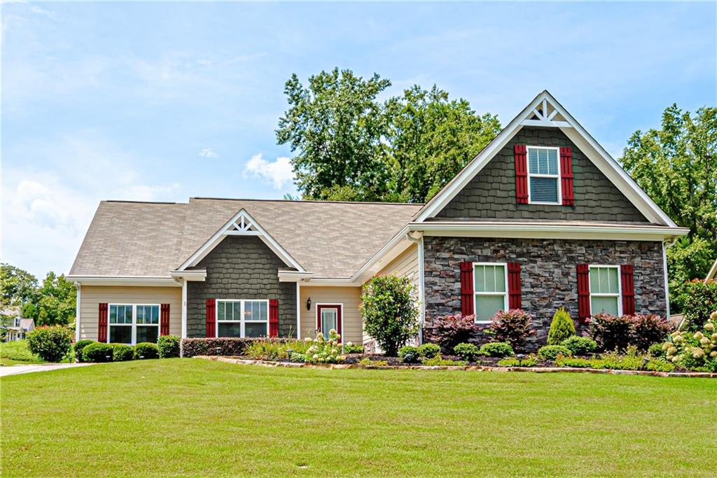 a front view of a house with a yard