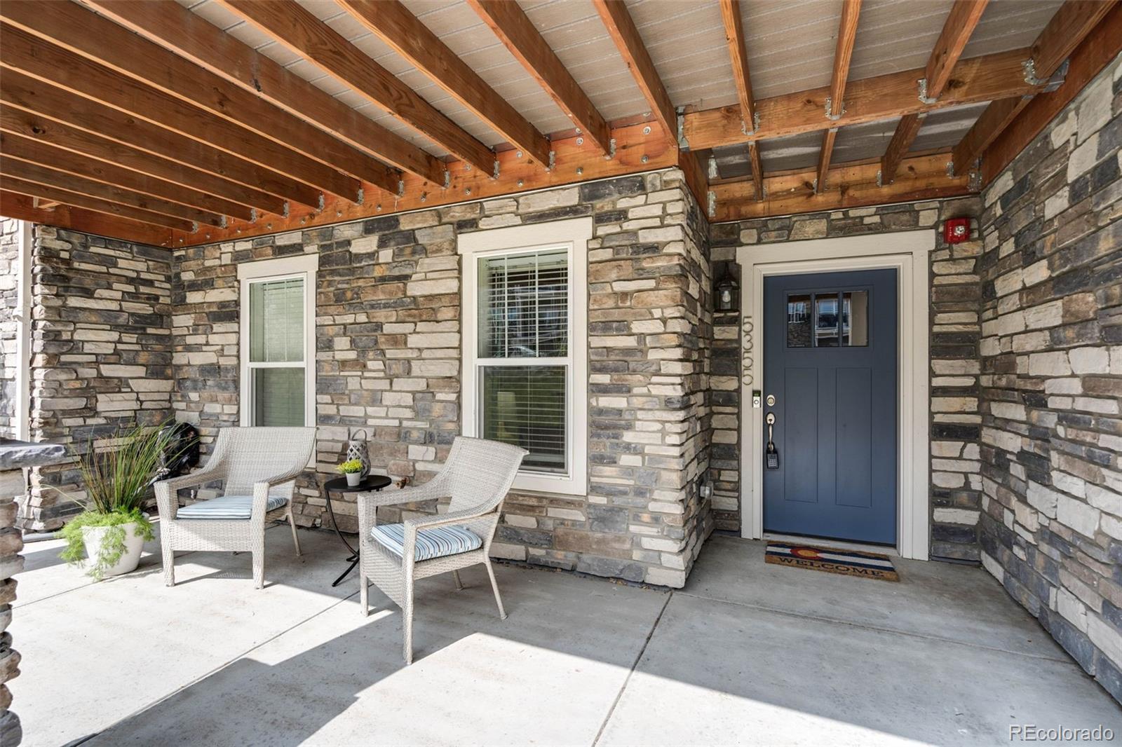 a patio with table and chairs