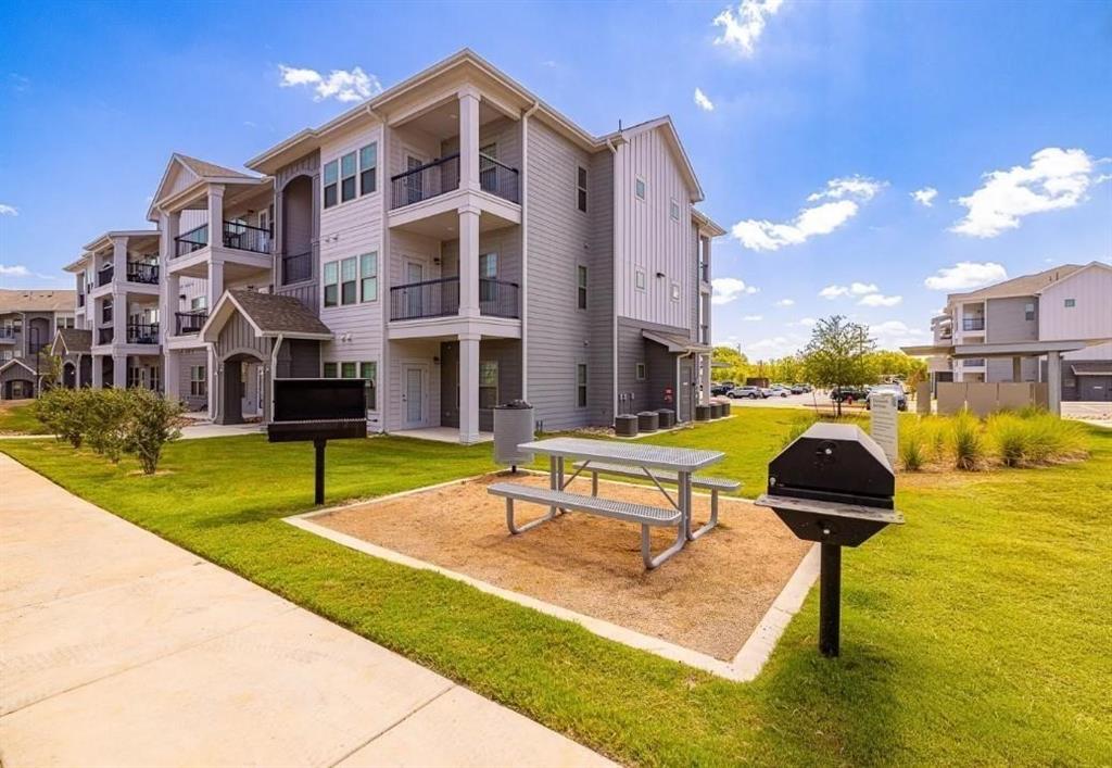 a building outdoor space with swimming pool and patio