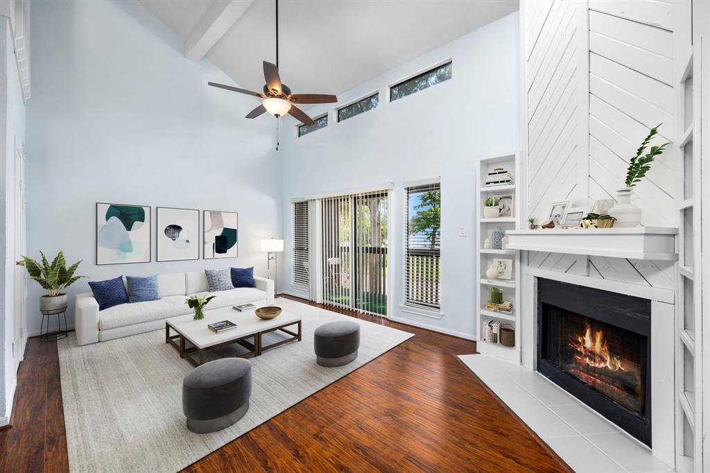 a living room with furniture fireplace and a fireplace