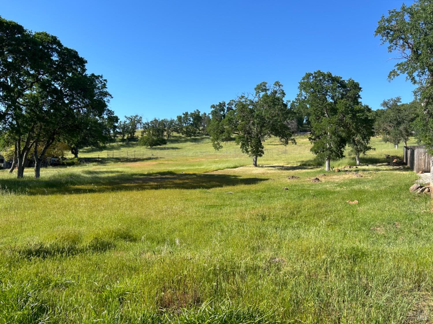 a view of a golf course with a lake view