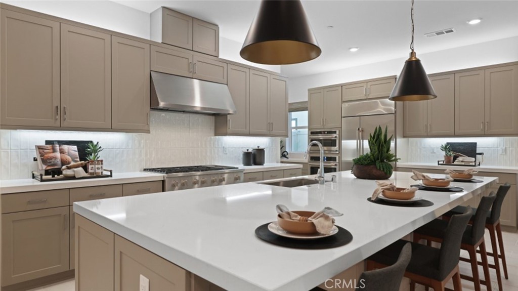 a kitchen with a sink a stove and cabinets