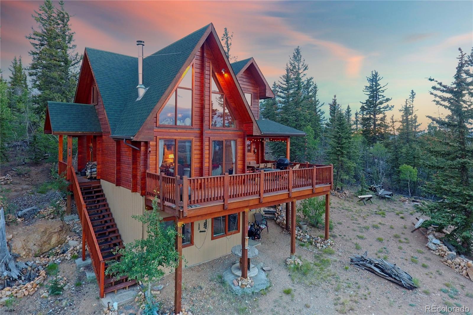 an aerial view of a house with roof deck front of house