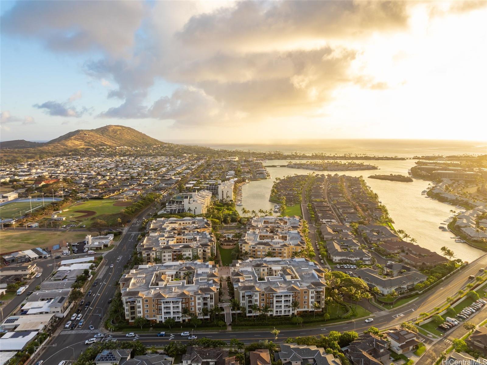 an aerial view of residential building and ocean