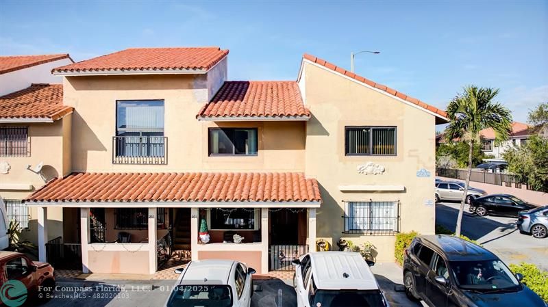 a front view of a house with parking