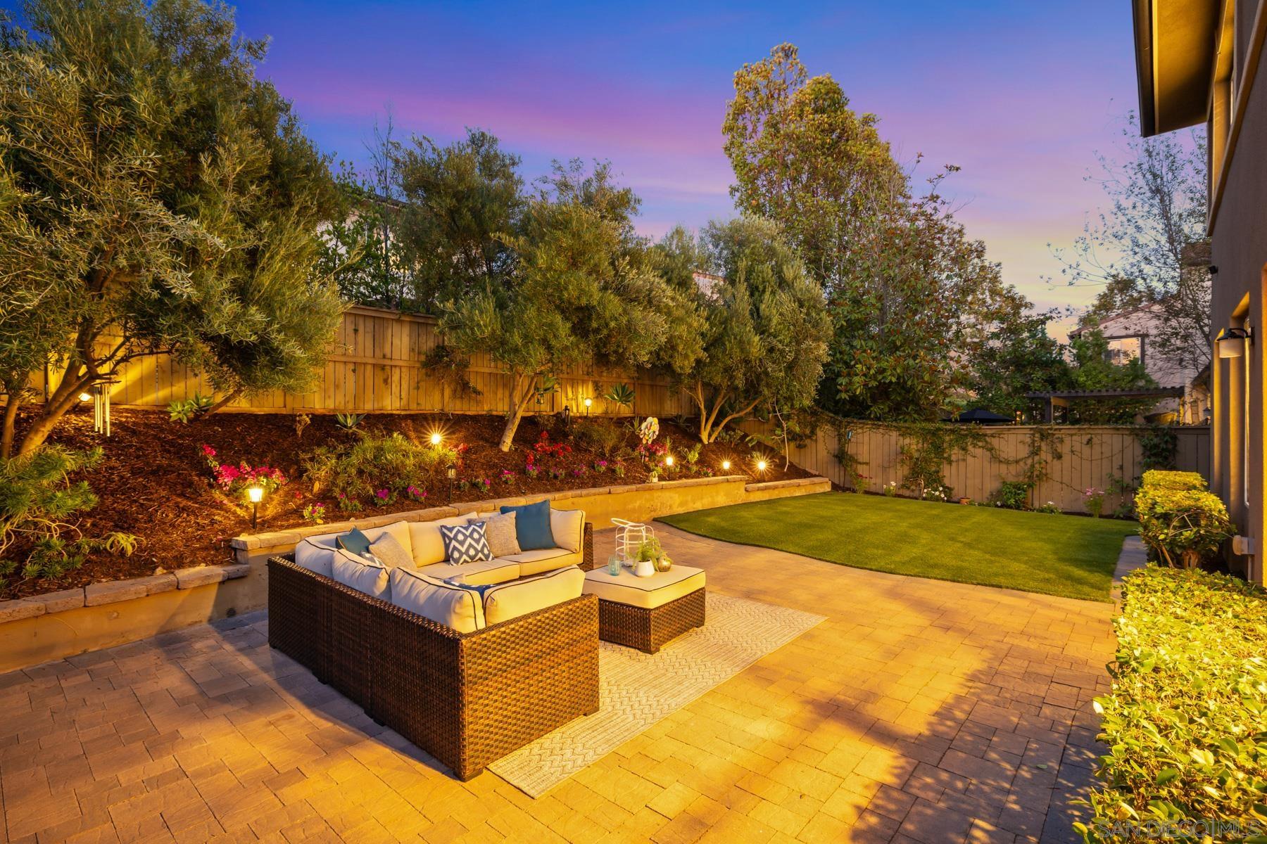 a view of a swimming pool with an outdoor space and seating area