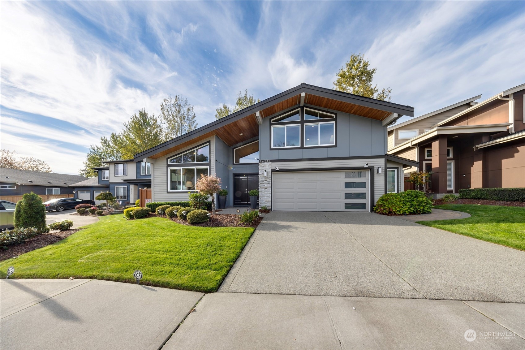 a front view of a house with a yard