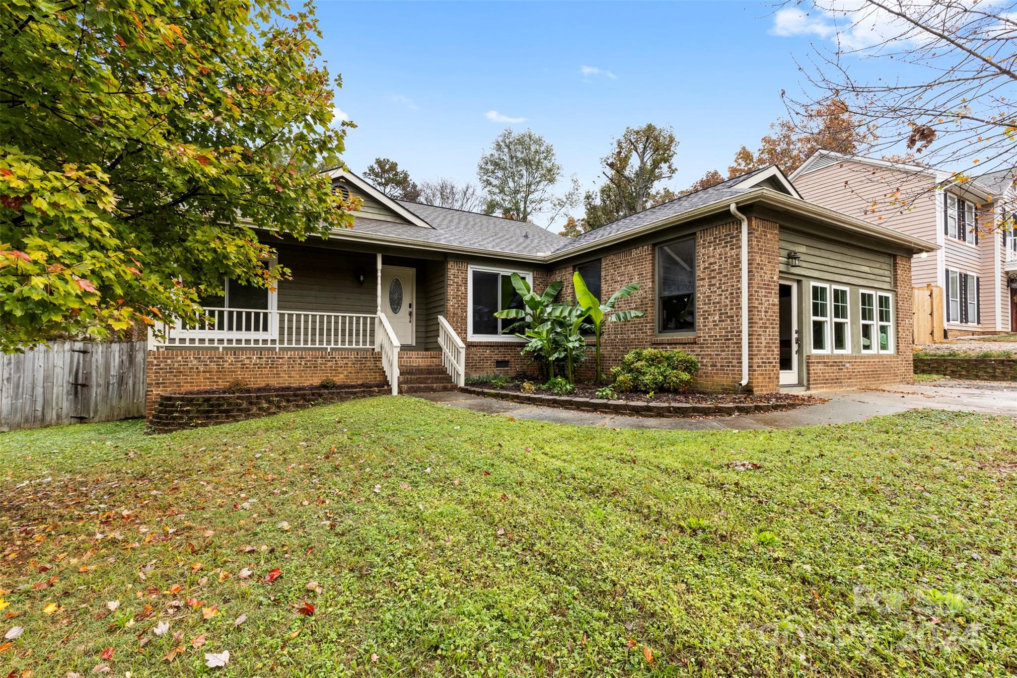 a front view of a house with garden