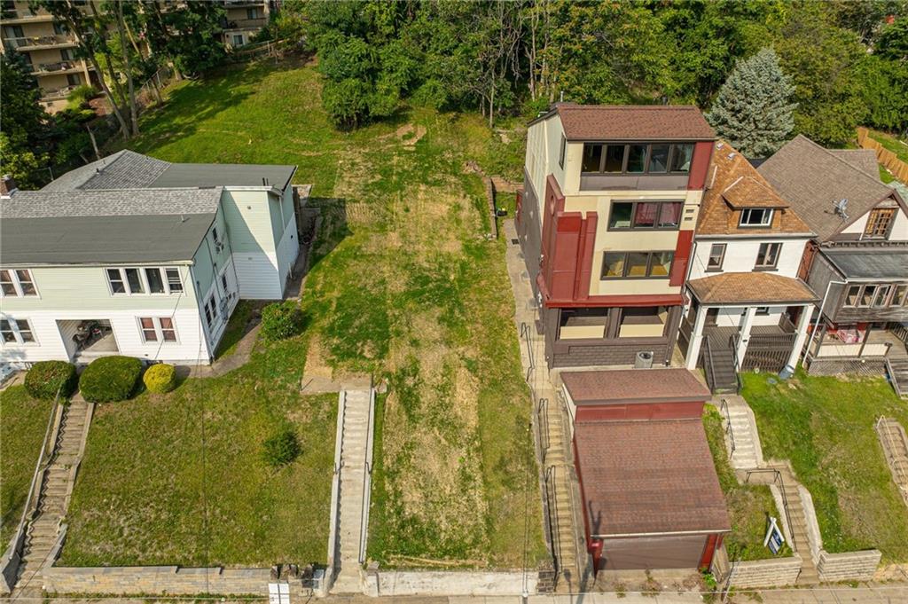 aerial view of a house with a yard