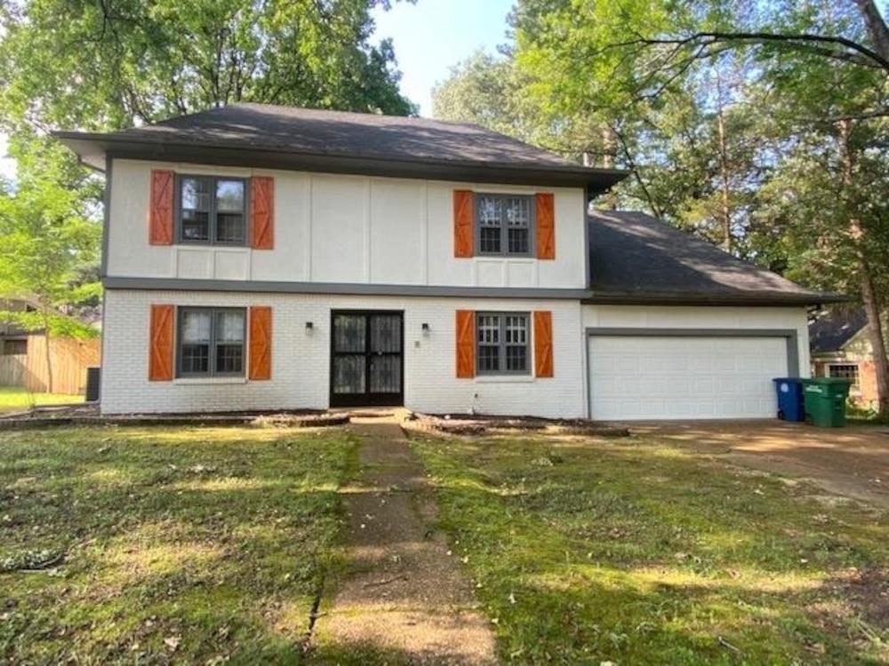 a house that has a big yard in front of it