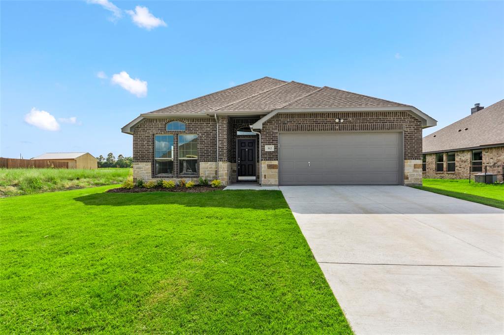 a front view of house with yard