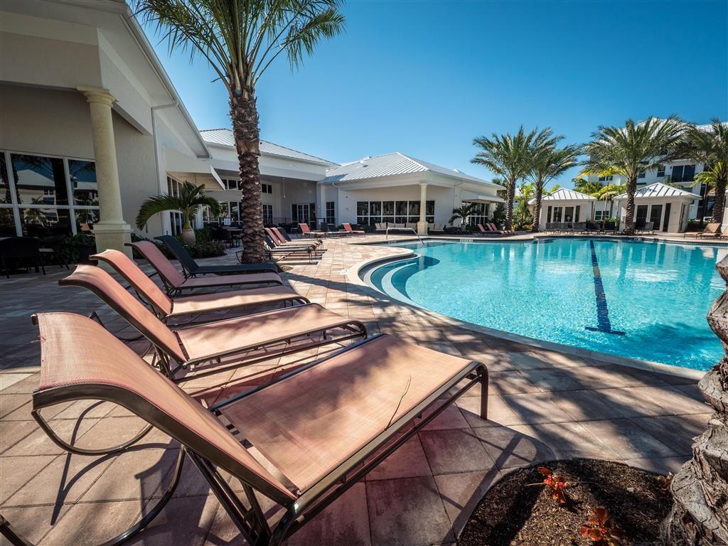 a view of a swimming pool with chairs