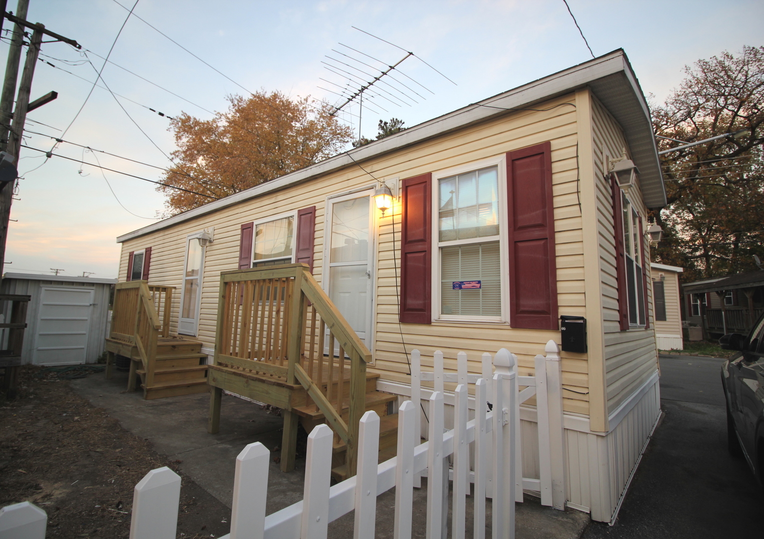 a view of a house with a small deck