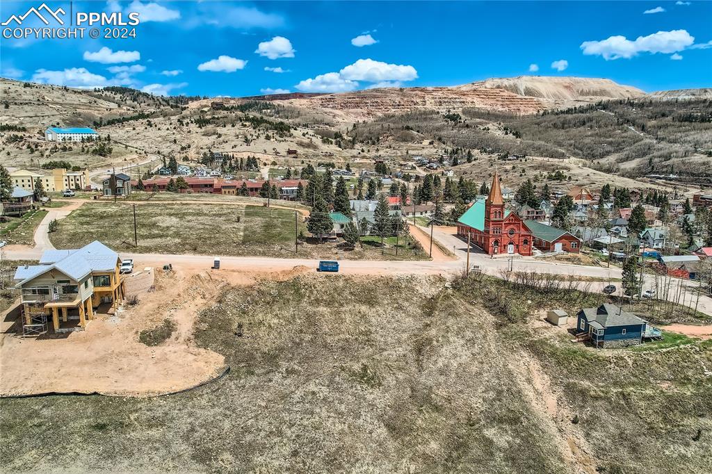 Lot sits on corner of Hayden and Golden Avenue. Aerial view from the west looking east at property