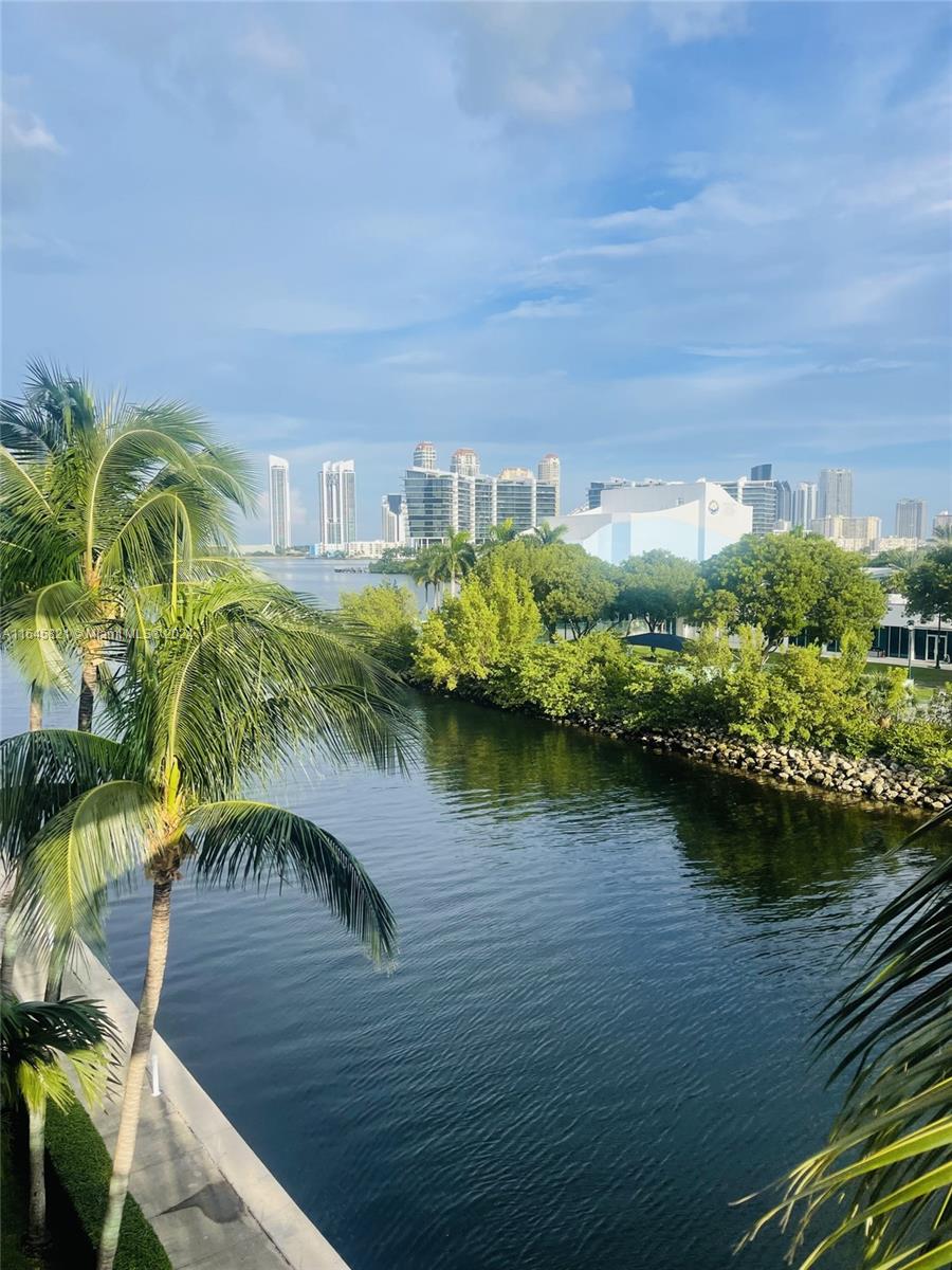 a view of a lake with a building in the background