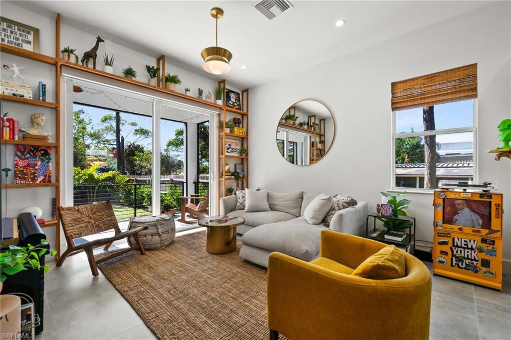 a living room with furniture and a large window