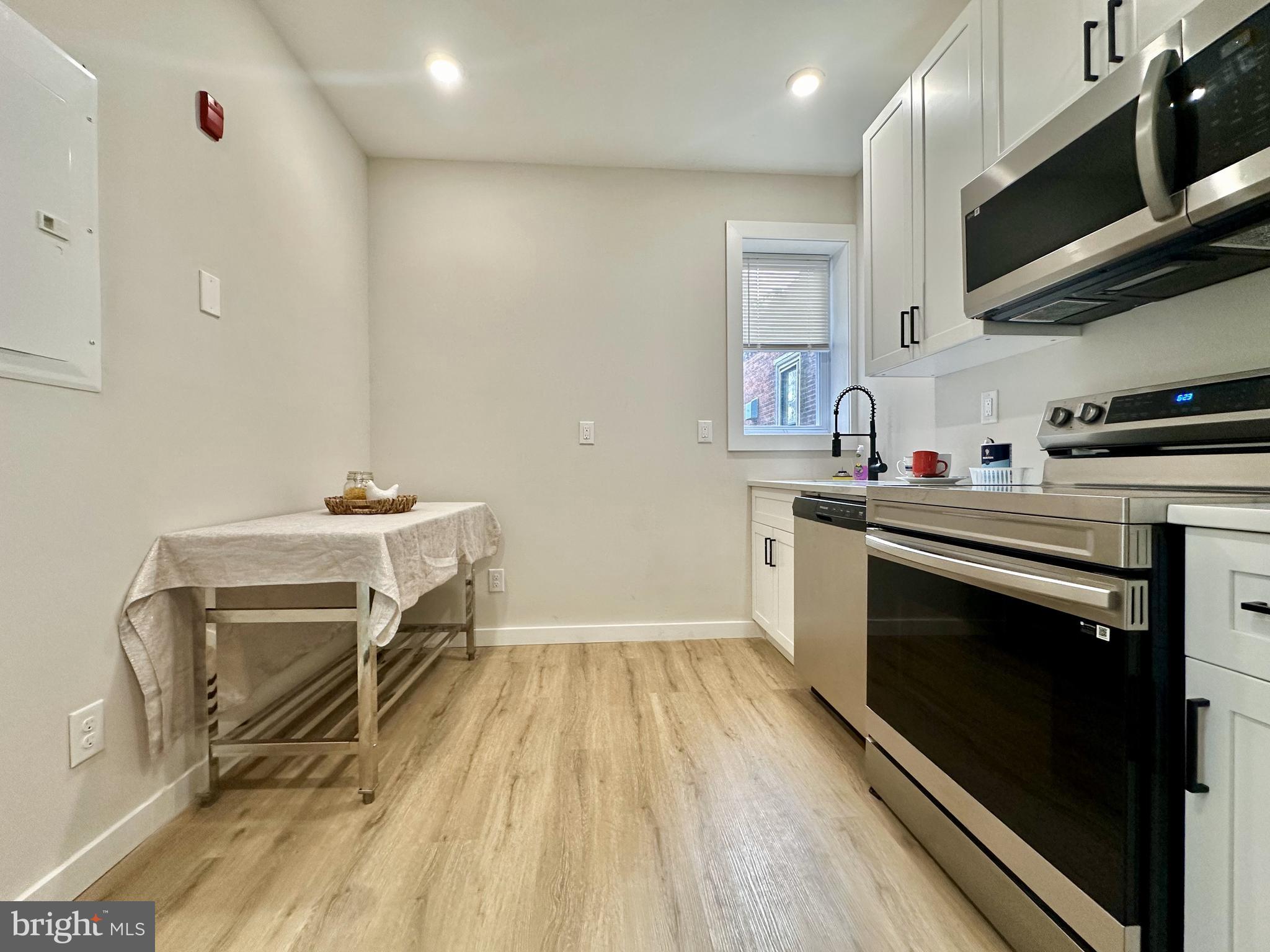 a kitchen with a stove and a microwave