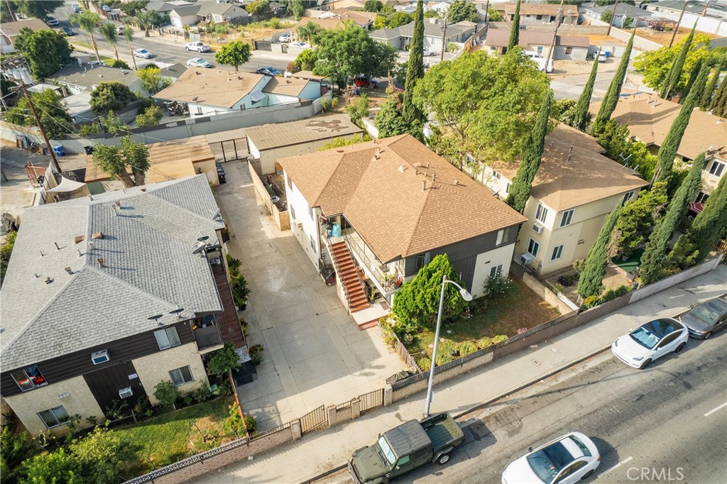 an aerial view of a house with outdoor space