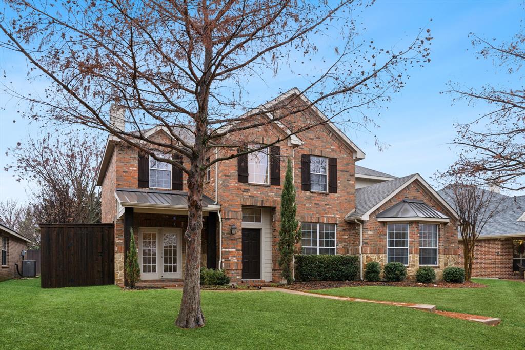 front view of a house with a yard