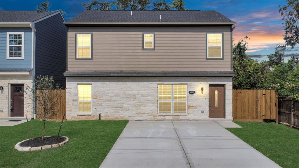 a front view of a house with a yard