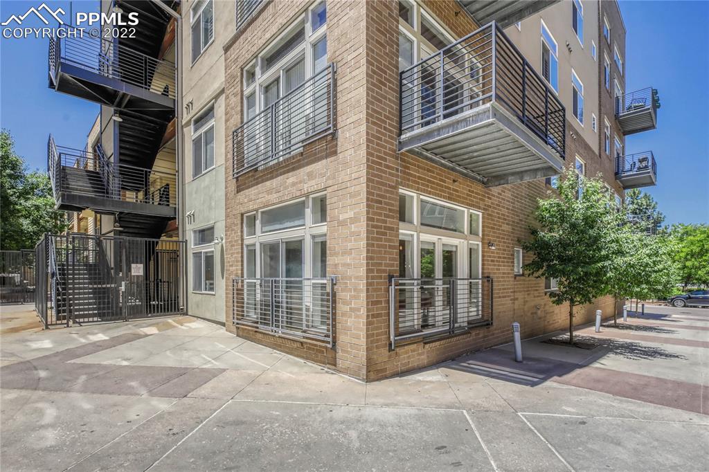 a view of a building with a door and a outdoor space